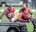  ?? AP FILE ?? San Francisco 49ers defensive end
Nick Bosa is driven off the field after being injured during the first half against the Jets last Sunday.