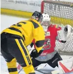  ?? Gw-images.com ?? Blackburn netminder Luke Wilson makes an excellent glove save just before being accidental­ly knocked out in a collision with Lee Kemp.