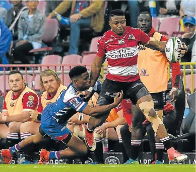  ?? Picture: ASHLEY VLOTMAN/GALLO IMAGES ?? FLYING TACKLE: Aphiwe Dyantyi, of the Lions, is tackled by Craig Barry, of the Stormers, during their Super Rugby match at the Newlands Stadium in Cape Town