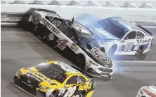  ?? AP PHOTO ?? UNINSPIRIN­G END: Dale Earnhardt Jr. (88) hits Kevin Harvick (4) as Harvick crashes in front him on Saturday night at Daytona Internatio­nal Speedway. The fan favorite finished 32nd in his billed finale at the famed track.