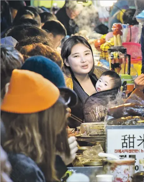  ??  ?? GWANGJANG MARKET in Seoul is considered the biggest food market in the city, with more than 200 vendor booths, many of which are particular­ly known for their mung bean pancakes. If you can find a common language, take a seat and shoot the breeze with your cook.