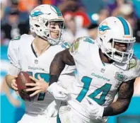  ?? JIM RASSOL/STAFF FILE PHOTO ?? QB Ryan Tannehill’s, left, favorite target the last three seasons has been Landry (14) who has compiled 288 receptions for 3,051 yards and 14 touchdowns.