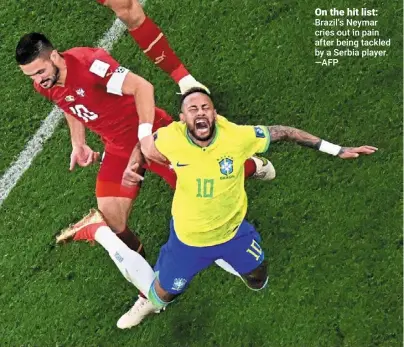  ?? ?? On the hit list: Brazil’s Neymar cries out in pain after being tackled by a Serbia player. —AFP
