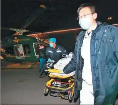  ?? LIU CHANG/ FOR CHINA DAILY ?? A 14-year-old boy who went into a coma when his heart stopped for 20 minutes arrives at Beijing Anzhen Hospital, Capital Medical University, after being airlifted by helicopter from Renqiu, Hebei province, on Tuesday night.
