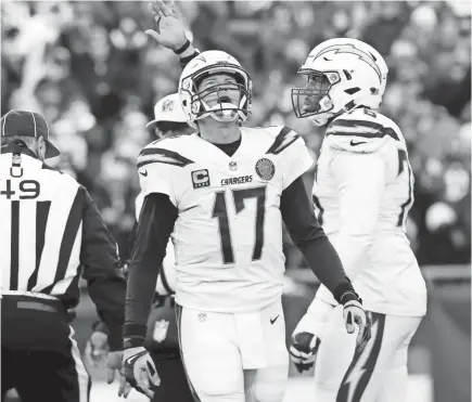  ?? DAVID BUTLER II/USA TODAY SPORTS ?? Chargers quarterbac­k Philip Rivers reacts after one of his two sacks Sunday but still threw for 331 yards and 3 TDs.