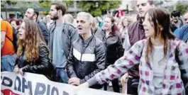  ??  ?? ATHENS: Members of the ‘All Workers militant front’ (PAME), a Trade Union coalition, take part in a demonstrat­ion marking a 24-hour general strike against a new round of austerity cuts imposed by the country’s internatio­nal creditors in Athens...