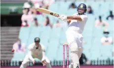  ??  ?? Rishabh Pant of India hits a boundary during the final day of the third Test against Australia at the Sydney Cricket Ground. — Reuters