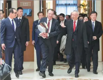  ?? SHEN HONG / XINHUA ?? Vice-Premier Liu He, US Trade Representa­tive Robert Lighthizer (center front) and US Treasury Secretary Steven Mnuchin (left) walk out of venue that was host to a new round of high-level economic and trade consultati­ons in Beijing on Thursday.