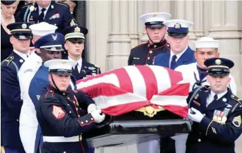  ?? — AFP ?? A Military Honour Guard carries the casket of Senator John Mccain at the end of his memorial service for at the Washington National Cathedral in Washington, DC.