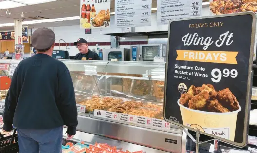  ?? NAM Y. HUH/AP ?? A customer shops at a grocery store in Mount Prospect, Illinois. The USDA says the food inflation rate will soar to its highest since 2008.