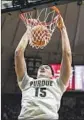  ?? Doug McSchooler AP ?? PURDUE center Zach Edey dunks en route to a win over Nicholls.