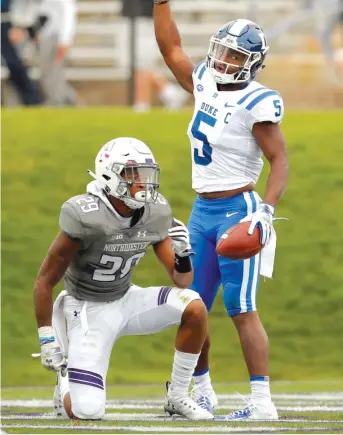  ?? JIM YOUNG/AP ?? Duke wide receiver Johnathan Lloyd celebrates his 52-yard touchdown catch against Northweste­rn cornerback Greg Newsome II in the second quarter Saturday in Evanston.