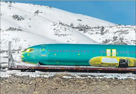  ?? William Campbell Corbis via Getty Images ?? A 737 MAX fuselage is transporte­d by train in March. Spirit Aerosystem­s of Kansas gets half of its revenue from making 737 fuselages.
