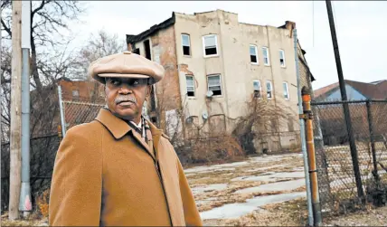  ?? NANCY STONE/CHICAGO TRIBUNE ?? The Rev. Byron Brazier, pastor of Apostolic Church of God, walks around the Woodlawn neighborho­od in 2017.