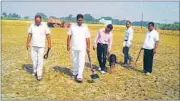  ?? RAJESH KUMAR/HT PHOTO ?? A bomb detection squad checks the Jayapur field where PM Narendra Modi’s chopper is set to land on Friday. The PM has decided to adopt Jayapur under Saansad Adarsh Gram Yojana.