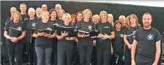  ??  ?? Musical director Stephen Povey from Kilmartin with Bar None community choir on Sunday in the whisky tent. Photo: Kevin McGlynn.