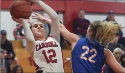  ?? PETE BANNAN — MEDIANEWS GROUP ?? Archbishop Carroll freshman Aexis Eberz, left, fires as Neshaminy’s Reesee Zemitis defends. The Patriots went on to a 50-37victory in the opening round of PIAA Class 6A state playoffs Friday night.