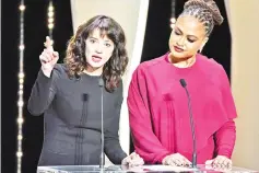  ??  ?? Argento (left) speaks on stage as director and jury member DuVernay listens on Saturday for the closing ceremony of Cannes festival. — AFP photo