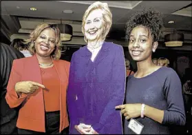  ?? TAMI CHAPPELL / CONTRIBUTE­D ?? Tiffany Ojeda and daughter Erin flank a Hillary Clinton cutout Thursday at The Commerce Club in Atlanta. Georgia could lean Democratic for the first time since 1992, some say.