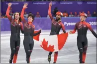  ?? THE CANADIAN PRESS/PAUL CHIASSON ?? The Canadian team of Samuel Girard, left to right, Charle Cournoyer, Charles Hamelin and Pascal Dion celebrate as they capture bronze in the men's 5,000-metre relay final celebrates at the Olympic Winter Games, in Gangneung, South Korea on Thursday.