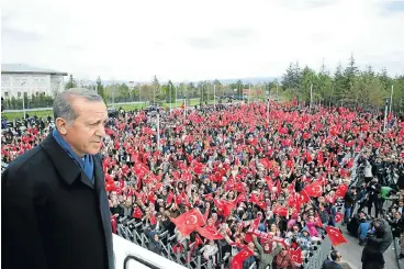  ?? /Reuters ?? Transition: Turkish President Tayyip Erdogan addresses his supporters upon his arrival at Esenboga Airport in Ankara, Turkey, on Monday. Foreign investors have fled Turkey in recent years due to a lack of political stability.