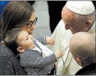  ?? AP/GREGORIO BORGIA ?? Pope Francis greets a child during Wednesday’s weekly audience at the Vatican ahead of next week’s trip to Latin America where he is expected to meet protest about sexual-abuse scandals.