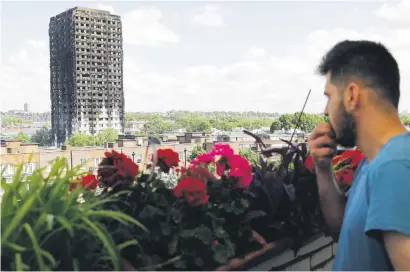  ?? Picture: AFP ?? STARK REMINDER. The remains of residentia­l tower block Grenfell Tower a day after it was gutted by fire. Firefighte­rs are still searching for bodies.