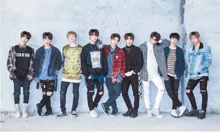  ?? Courtesy of JYP ?? Stray Kids members pose for the camera. The K-pop band made its debut last week, releasing its first album “District 9.” The debut music video has since gone viral, getting 14 million YouTube views.