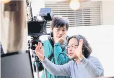  ?? — Bernama photo ?? Lim (right) together with the Director of Photograph­y, Furuya Koichi during the shooting of the film “Come and Go”, that described the trials and dreams of Japanese and foreigners in Osaka.