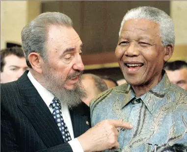  ?? PICTURE: REUTERS ?? COMRADES: Fidel Castro and former SA president Nelson Mandela share a light moment during Castro’s visit to Mandela’s home in Houghton in 2001. Mandela was known to refer to Castro as ‘brother’ and was one of the first internatio­nal leaders he met...