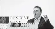  ?? Birgit Krippner / Bloomberg ?? Adrian Orr, governor of the Reserve Bank of New Zealand, speaks after cutting interest rates.