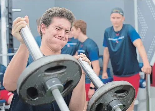  ?? PETER LEE WATERLOO REGION RECORD ?? Jesse Fishman gives it all he’s got on the landmine press during the first day of the Kitchener Rangers training camp on Monday.