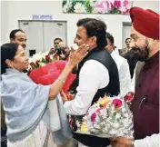  ??  ?? Uttar Pradesh Chief Minister Akhilesh Yadav welcomed West Bengal Chief Minister and All India Trinamool Congress (TMC) chief Mamata Banerjee at the Chaudhary Charan Singh Internatio­nal Airport in Lucknow on Monday evening