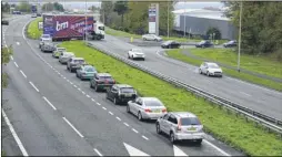  ??  ?? Traffic builds up on the exit and entry to the retail park; our report on the death trap claims