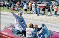  ??  ?? Grand Marshal Pat Cates waves to the crowd during the Jane Days parade.