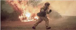  ?? PICTURE: AP/AFRICAN NEWS AGENCY (ANA) ?? A firefighte­r tries to save a home as a wildfire tears through Lakeport, California, on Tuesday.