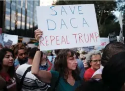  ?? SPENCER PLATT/GETTY IMAGES ?? Hundreds attend a rally and march to Trump Tower in support of the Deferred Action for Childhood Arrivals program (also known as DACA) in New York City.