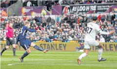  ?? REUTERS ?? Tottenham’s Christian Eriksen scores their first goal against Swansea.