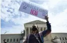  ?? Images ?? An activist stands in front of the US supreme court building in Washington DC on 1 April. Biden’s proposal would prohibit outright bans but allow limits for fairness. Photograph: Andrew Caballero-Reynolds/AFP/Getty