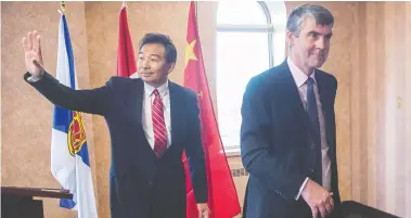  ?? THE CANADIAN PRESS / FILES ?? Luo Zhaohui, then China's ambassador to Canada, with Nova Scotia Premier Stephen McNeil in Halifax in 2016.