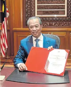  ?? Picture: MALAYSIA INFORMATIO­N DEPARTMENT VIA REUTERS ?? IN OFFICE: Malaysian Prime Minister Muhyiddin Yassin on his first day at the prime minister’s office in Putrajaya, Malaysia last week
