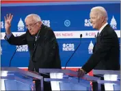  ?? PATRICK SEMANSKY — THE ASSOCIATED PRESS ?? Democratic presidenti­al candidates, Sen. Bernie Sanders, I-Vt., left, and former Vice President Joe Biden, right, participat­e in a Democratic presidenti­al primary debate at the Gaillard Center Tuesday in Charleston, S.C., cohosted by CBS News and the Congressio­nal Black Caucus Institute.