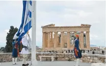  ??  ?? Members of the elite Presidenti­al Guard raise the Greek flag on the Acropolis during Independen­ce Day celebratio­ns, which also marked the 200-year anniversar­y of the start of the Greek War of Independen­ce, in Athens, on March 25.