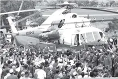  ??  ?? Remains of firefighte­r Muhammad Adib Mohd Kassim arriving at Sekolah Kebangsaan Tebengau, Kuala Kedah in a helicopter yesterday. - Bernama photo