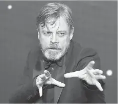  ??  ?? Hamill gestures as he arrives at the European Premiere of ‘Star Wars,The Force Awakens’ in London, on Dec 16, 2015.