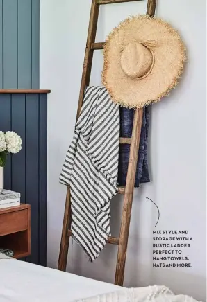  ?? ?? MIX STYLE AND STORAGE WITH A RUSTIC LADDER PERFECT TO HANG TOWELS, HATS AND MORE.