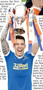  ?? ?? HAPPY JACK: Rangers’ goal hero holds the cup aloft