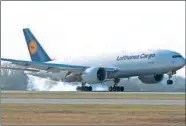  ?? (AFP) ?? A Lufthansa cargo plane Boeing 777 arrives at the Franz-JosefStrau­ss airport in Munich recently.