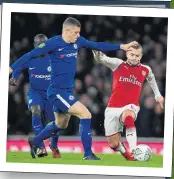  ??  ?? DEBUT: Barkley battles with Wilshere