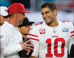  ?? Tribune News Service ?? San Francisco 49ers head coach Kyle Shanahan, left, talks with quarterbac­k Jimmy Garoppolo (10) prior to Super Bowl LIV against the Kansas City Chiefs at Hard Rock Stadium in Miami.